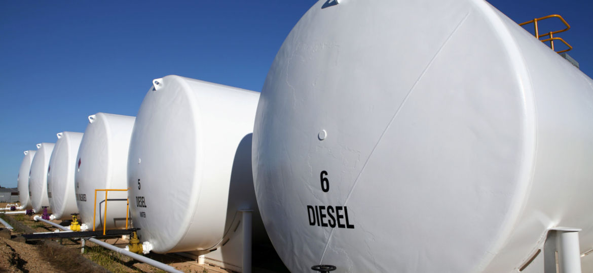 Enormous white diesel fuel tanks lined up in Houston, Texas
