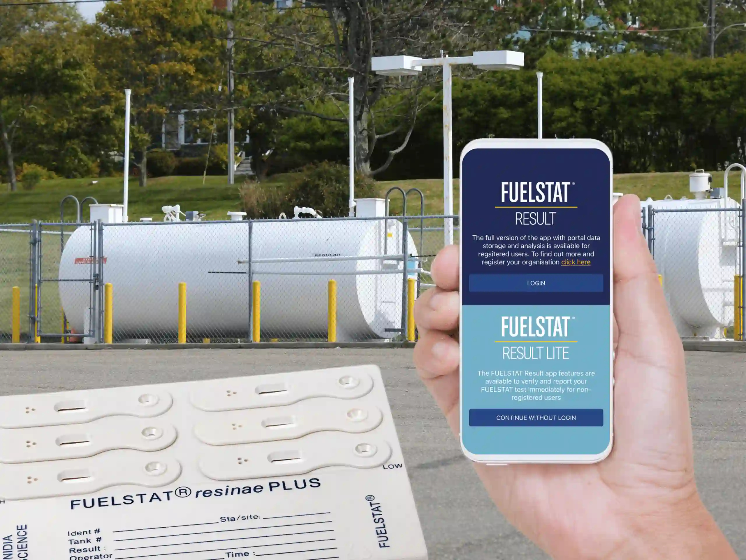 Hand holding a phone with Fuelstat test kit results app